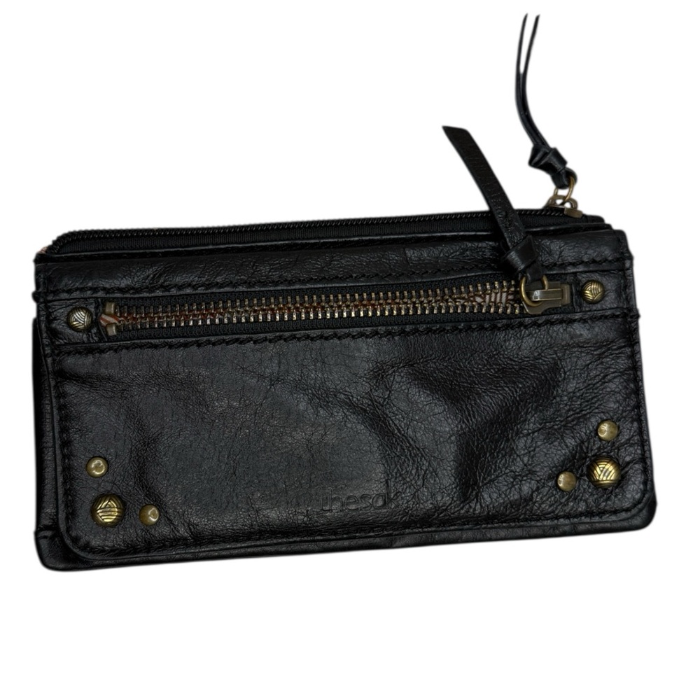 The Sak Black Leather Zip Wristlet with Brass Studs